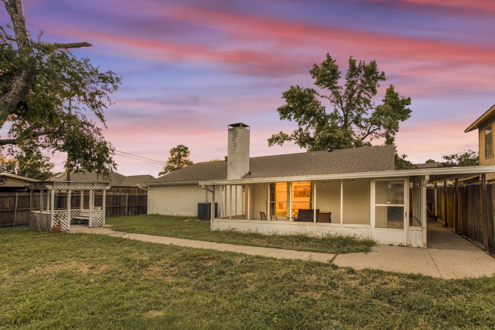 Rear exterior of 1142 Via Del Rey showing the covered porch and arbor