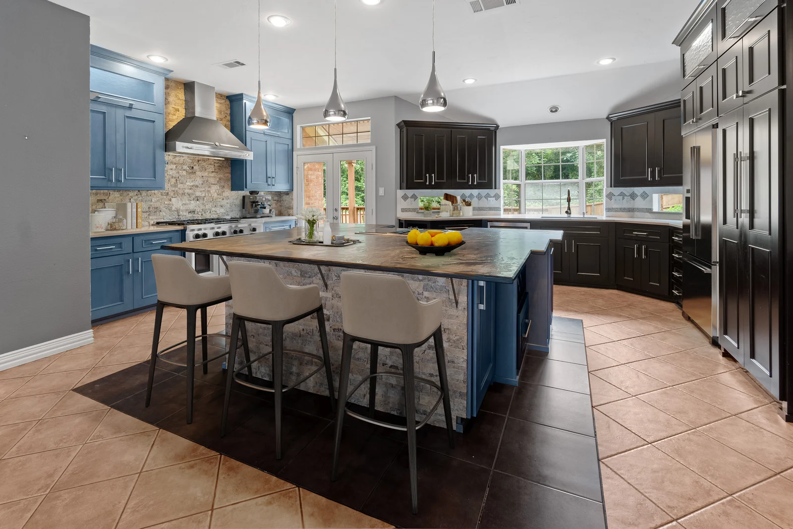 Kitchen view at 4100 Crest Ridge Drive with an island and contrasting blue and dark cabinetry