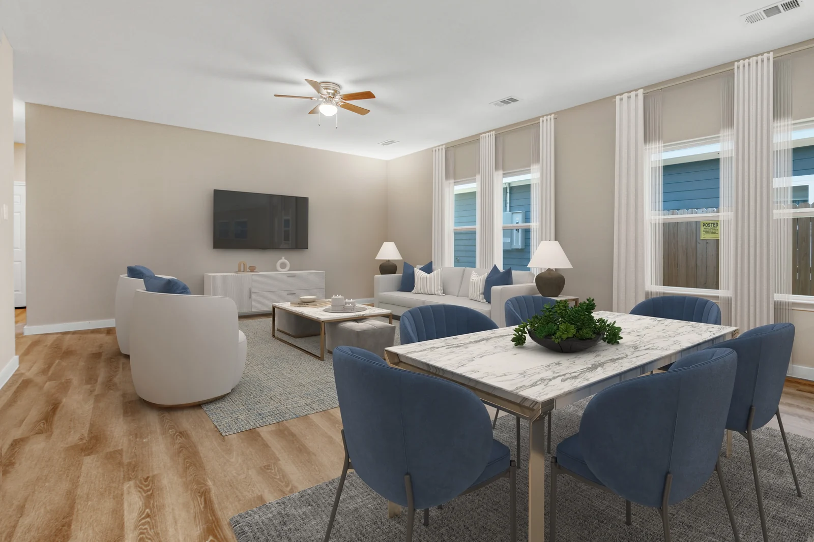 Living and dining areas at 4832 Nome Street beside a row of windows