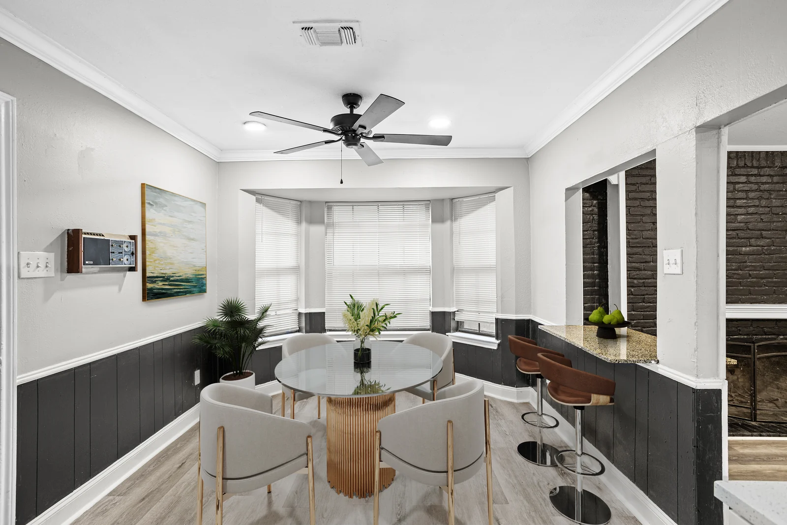 Dining area at 5714 Tumbleweed Court with a bay window and breakfast bar