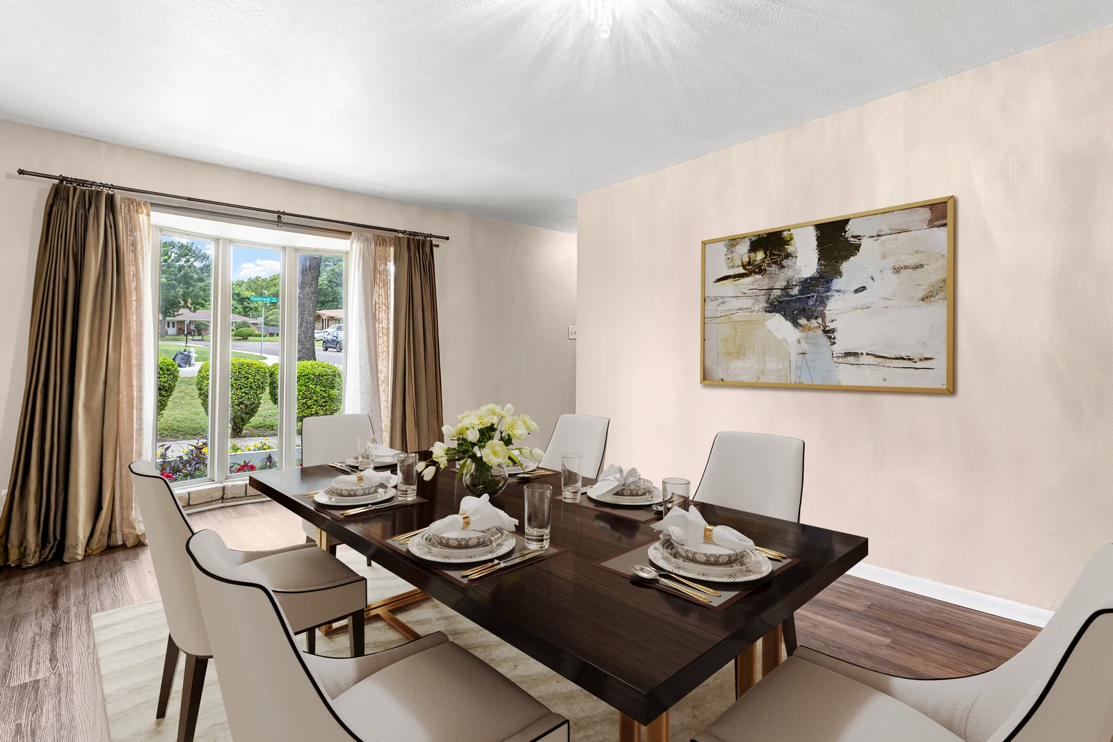 Dining-room view at 6930 Trailcrest Drive with the table and front-facing window