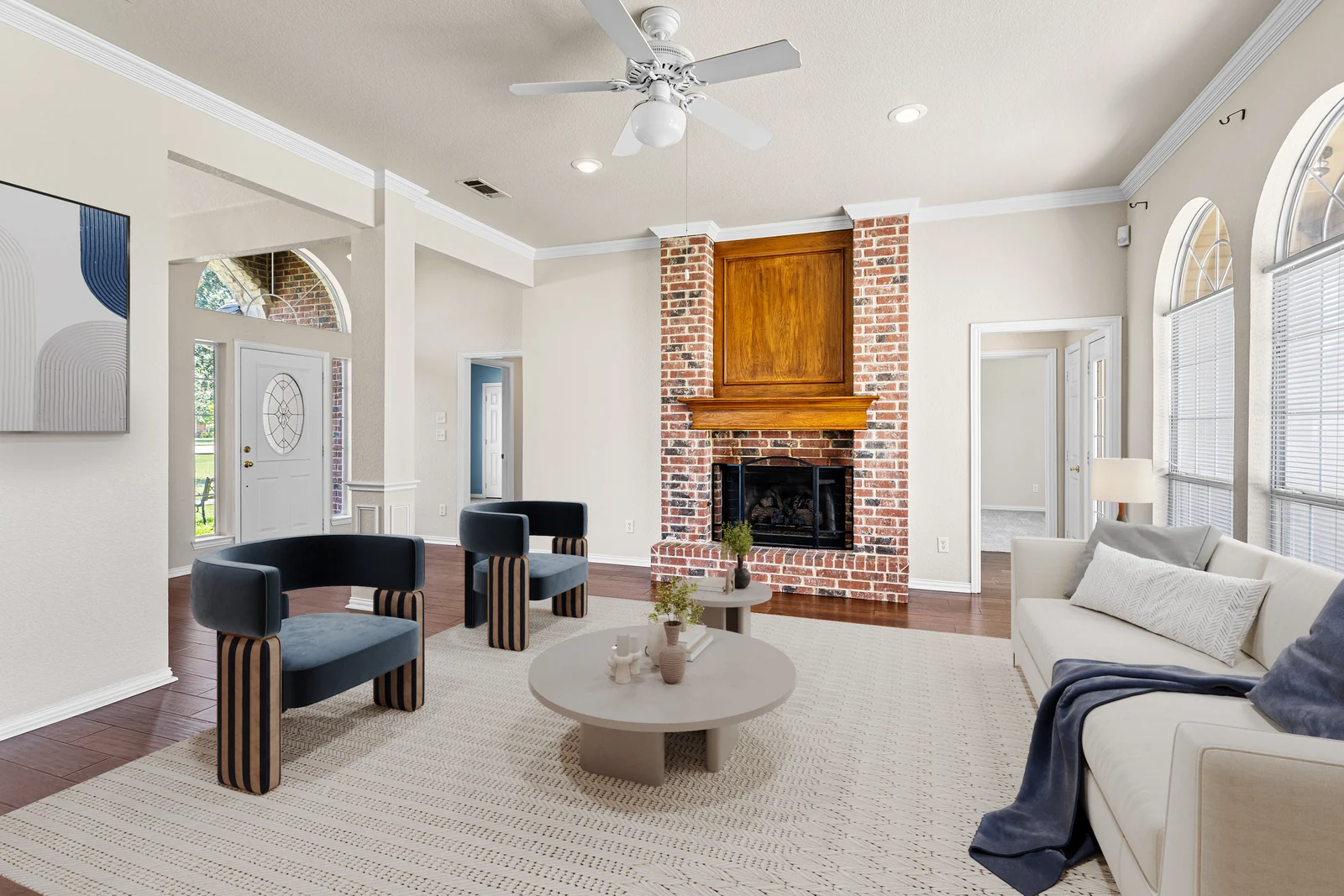 Living-room view at 9530 Blarney Stone Way with a brick fireplace and the entry beyond